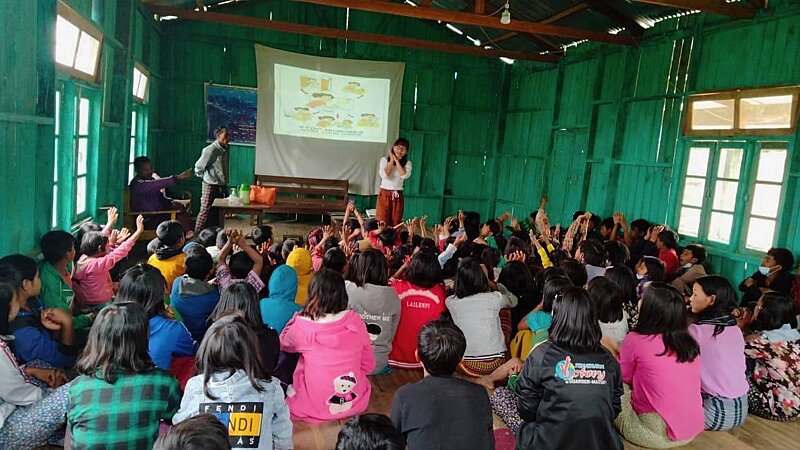 Teaching children a hand washing dance